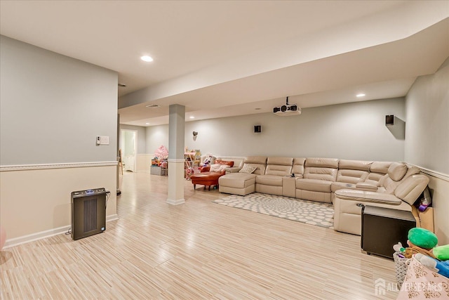 living room featuring recessed lighting, light wood finished floors, and baseboards