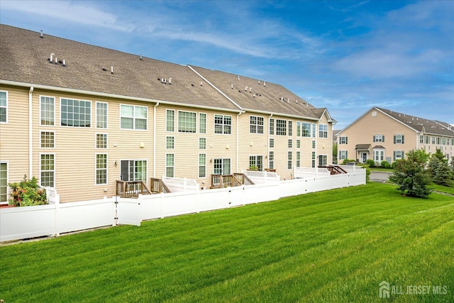 back of property featuring a residential view
