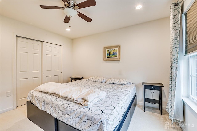 bedroom featuring light carpet, a closet, baseboards, recessed lighting, and ceiling fan