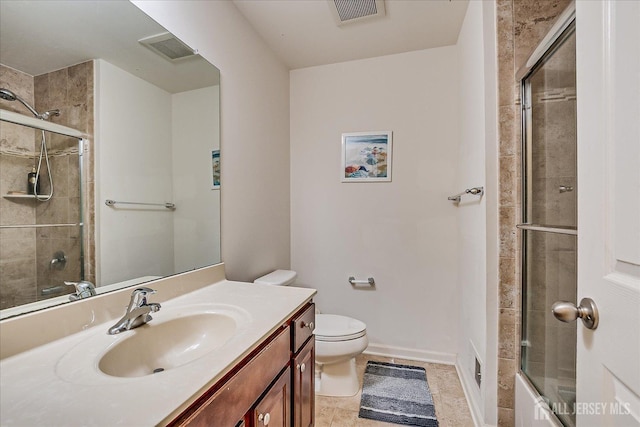 full bath with toilet, vanity, and baseboards