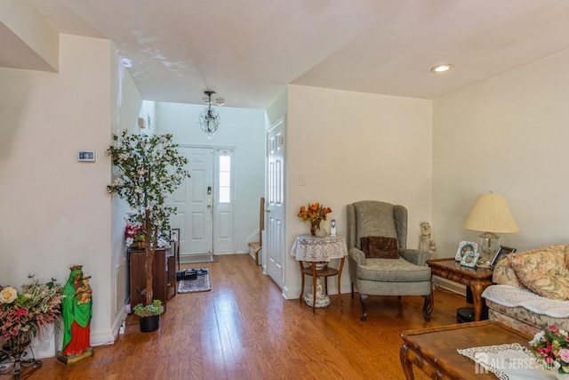 entryway featuring baseboards and wood finished floors