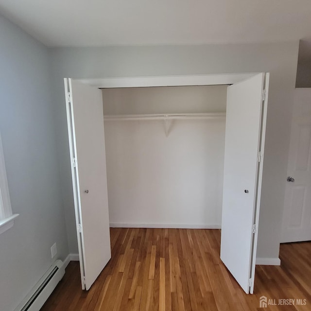 closet featuring baseboard heating