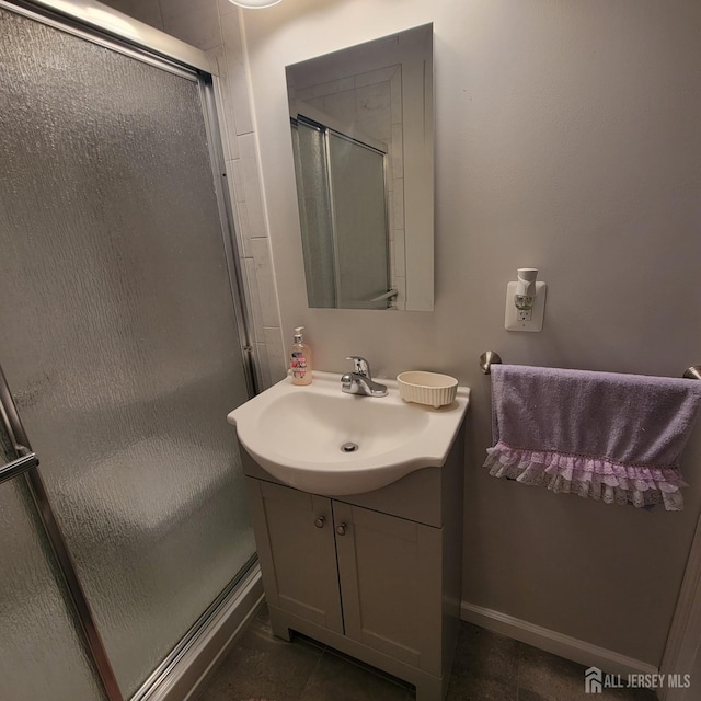 bathroom featuring vanity, tile patterned flooring, and a shower stall