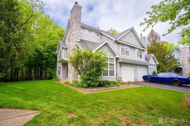 42 Haymarket Ct, East Windsor, NJ 08520 - view of home's exterior with a chimney, a garage, driveway, and a yard