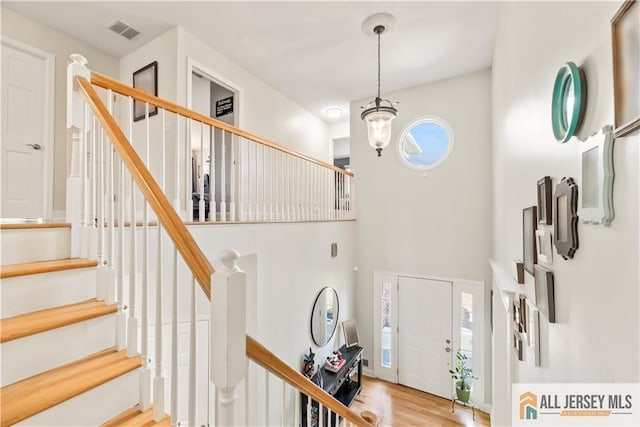 11 Hilltop Blvd N, East Brunswick, NJ 08816 - foyer with stairs, light wood finished floors, and a high ceiling