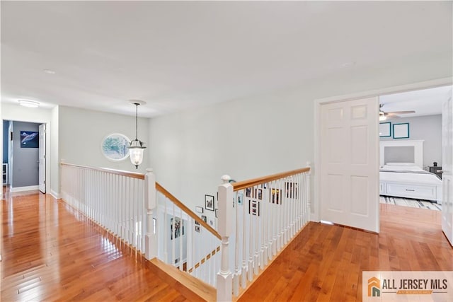 11 Hilltop Blvd N, East Brunswick, NJ 08816 - hall featuring an upstairs landing and wood-type flooring