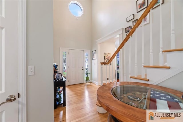 11 Hilltop Blvd N, East Brunswick, NJ 08816 - foyer with wood finished floors, stairway, a towering ceiling, and baseboards