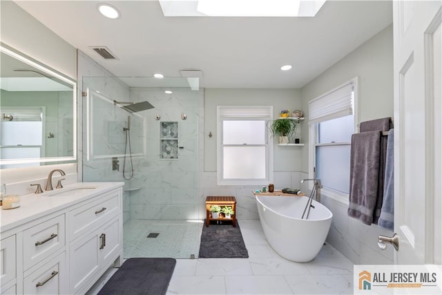 11 Hilltop Blvd N, East Brunswick, NJ 08816 - bathroom featuring a freestanding bath, a marble finish shower, vanity, marble finish flooring, and recessed lighting