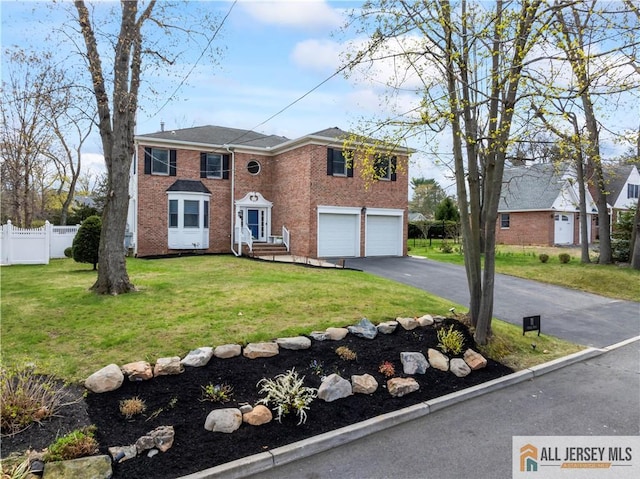 11 Hilltop Blvd N, East Brunswick, NJ 08816 - view of front of home with asphalt driveway, a garage, and brick siding