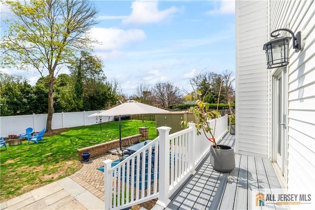 11 Hilltop Blvd N, East Brunswick, NJ 08816 - wooden deck featuring a fire pit and a patio area