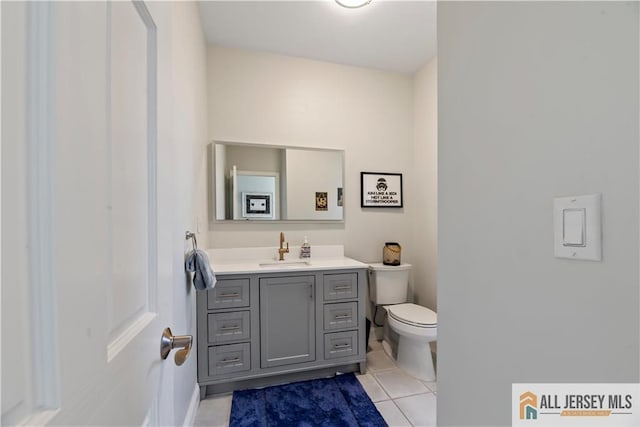 11 Hilltop Blvd N, East Brunswick, NJ 08816 - bathroom with tile patterned flooring, toilet, vanity, and baseboards