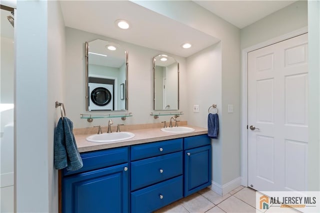 11 Hilltop Blvd N, East Brunswick, NJ 08816 - full bath featuring estacked washer and dryer, tile patterned flooring, and double vanity