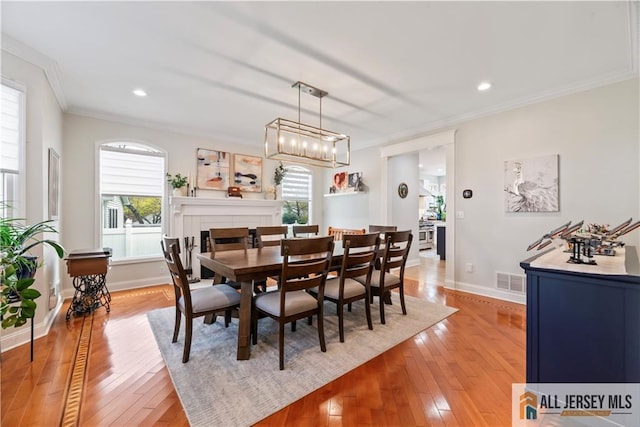 11 Hilltop Blvd N, East Brunswick, NJ 08816 - dining space featuring ornamental molding, light wood-style floors, baseboards, and recessed lighting