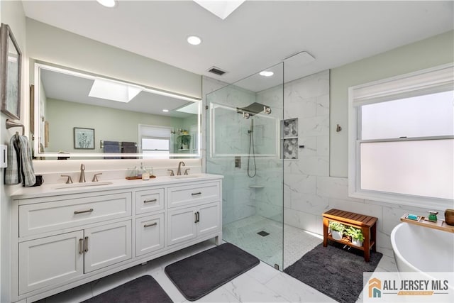 11 Hilltop Blvd N, East Brunswick, NJ 08816 - bathroom with a skylight, a marble finish shower, a freestanding tub, double vanity, and marble look tiles