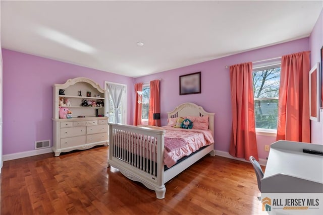 11 Hilltop Blvd N, East Brunswick, NJ 08816 - bedroom with multiple windows, wood finished floors, and baseboards