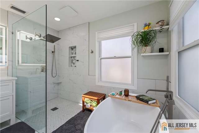 11 Hilltop Blvd N, East Brunswick, NJ 08816 - full bath featuring a freestanding tub, a marble finish shower, and recessed lighting