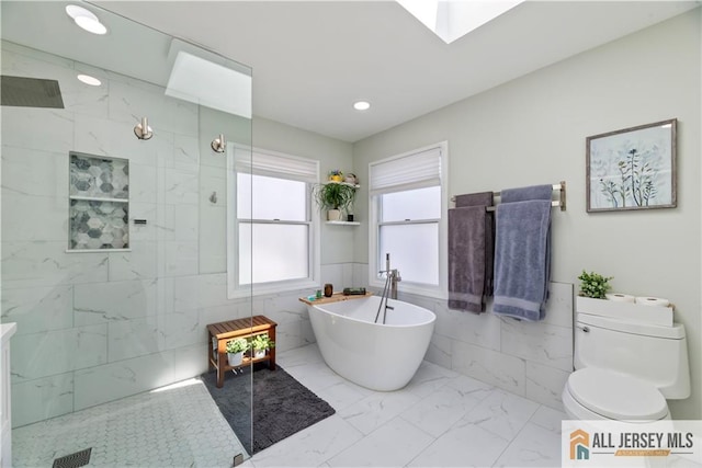 11 Hilltop Blvd N, East Brunswick, NJ 08816 - bathroom with tile walls, a soaking tub, marble finish flooring, a walk in shower, and toilet
