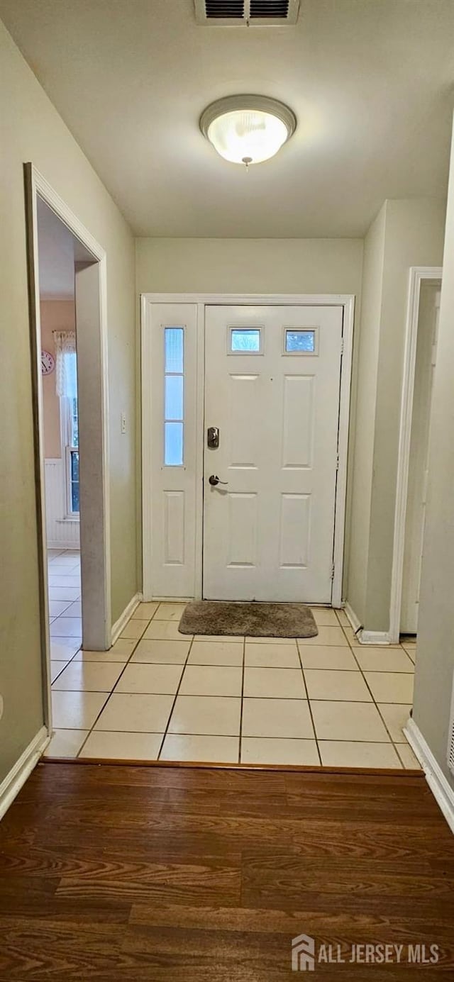 2003 Timber Oaks Rd, Edison, NJ 08820 - entryway featuring light tile patterned floors and baseboards