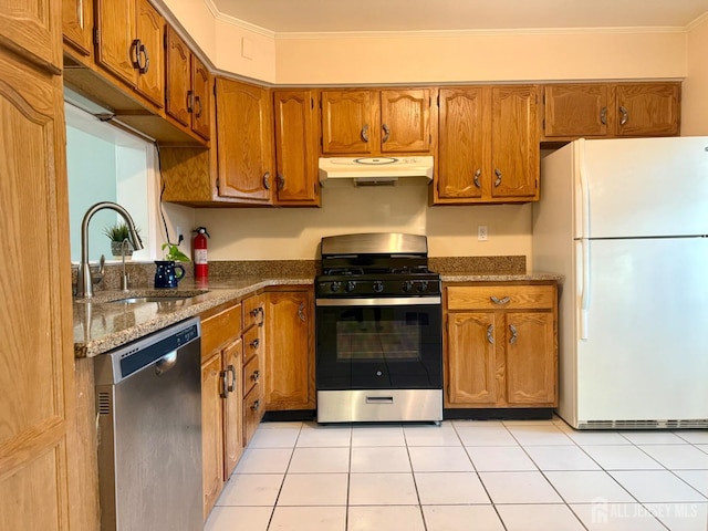 2003 Timber Oaks Rd, Edison, NJ 08820 - kitchen featuring appliances with stainless steel finishes, under cabinet range hood, brown cabinets, dark stone countertops, and crown molding