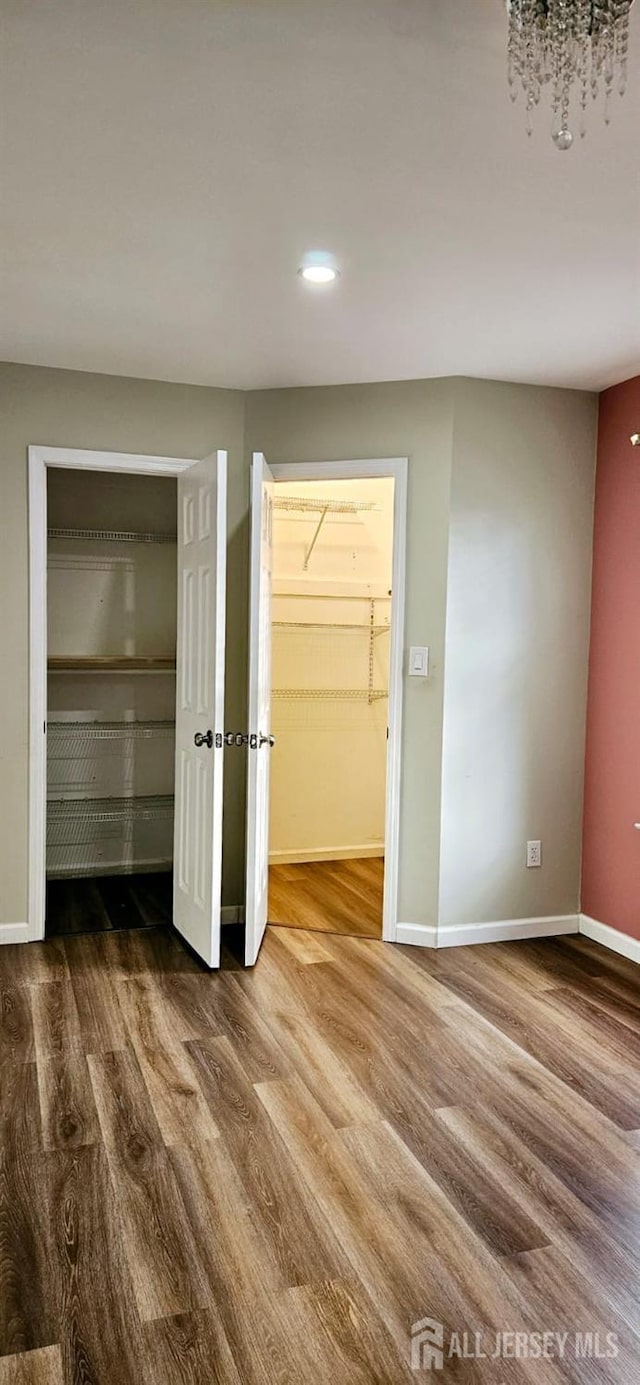 2003 Timber Oaks Rd, Edison, NJ 08820 - unfurnished bedroom with wood finished floors and recessed lighting