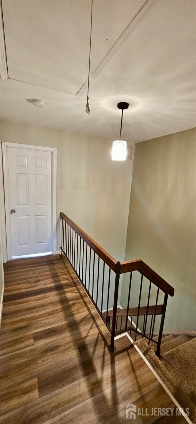 2003 Timber Oaks Rd, Edison, NJ 08820 - hall with dark wood-style flooring, attic access, and an upstairs landing