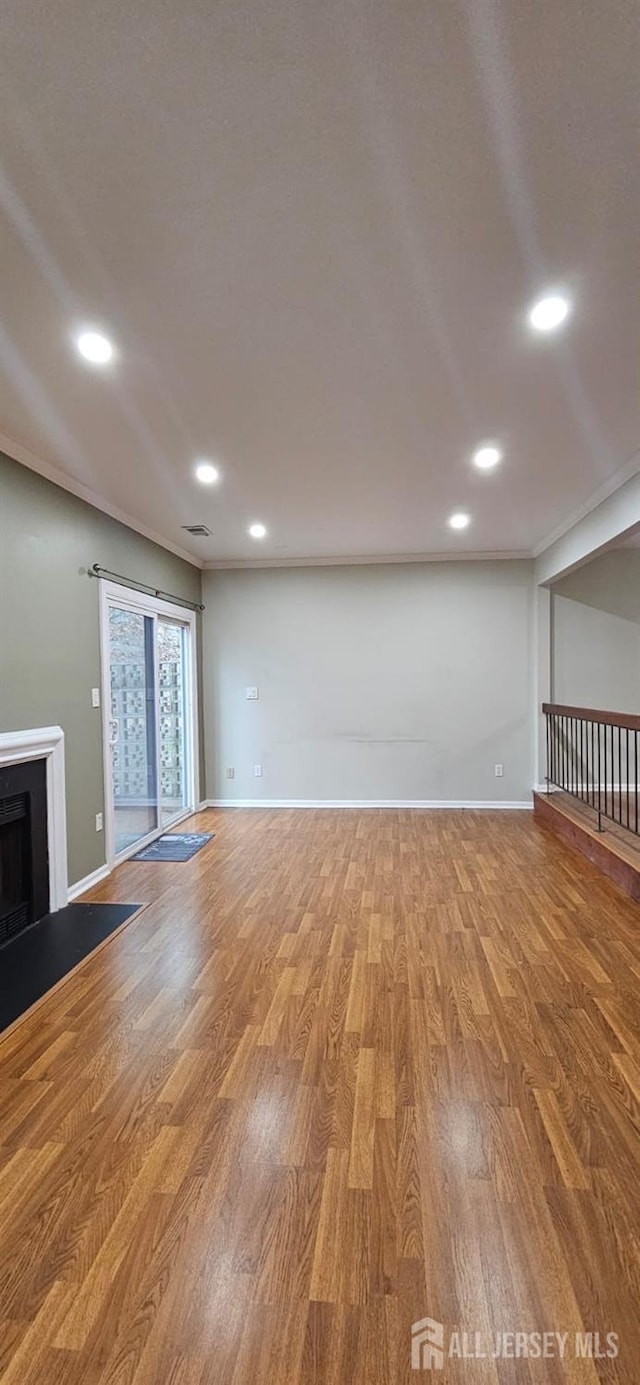 2003 Timber Oaks Rd, Edison, NJ 08820 - unfurnished living room with wood finished floors, recessed lighting, and a fireplace