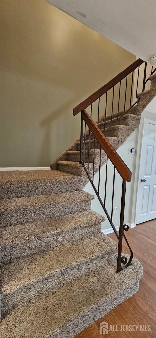 2003 Timber Oaks Rd, Edison, NJ 08820 - stairs featuring wood finished floors and baseboards