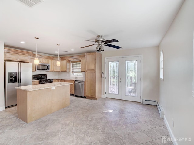 kitchen featuring light brown cabinets, stainless steel appliances, visible vents, french doors, and a center island