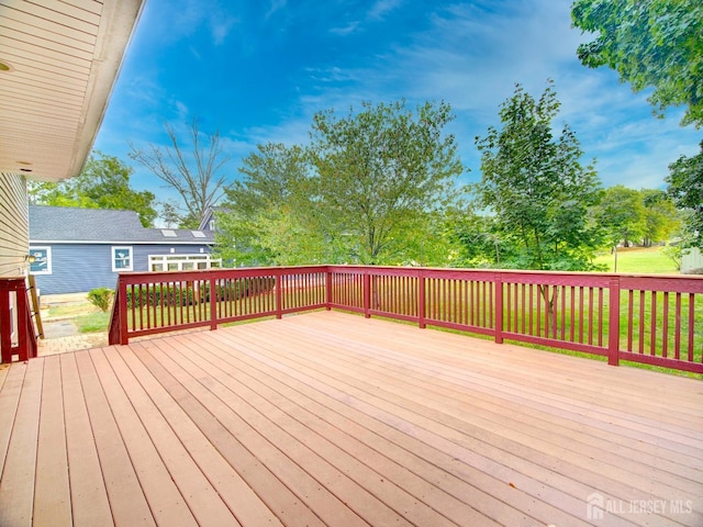 deck featuring a lawn