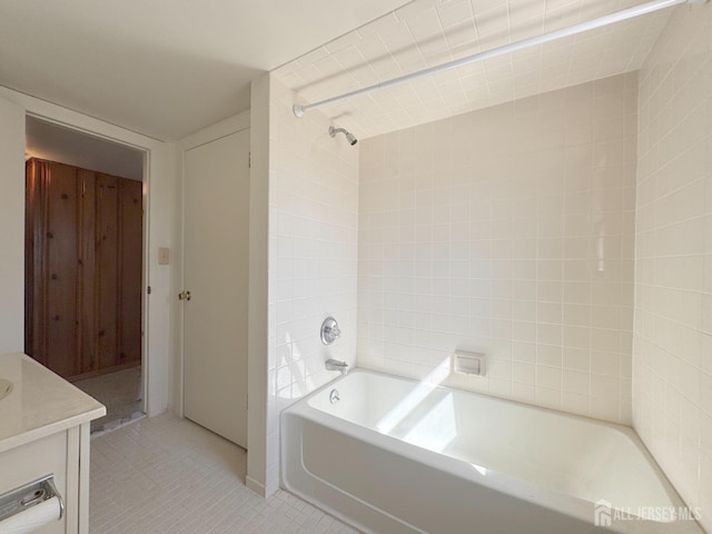 bathroom with tile patterned floors, shower / bath combination, and vanity