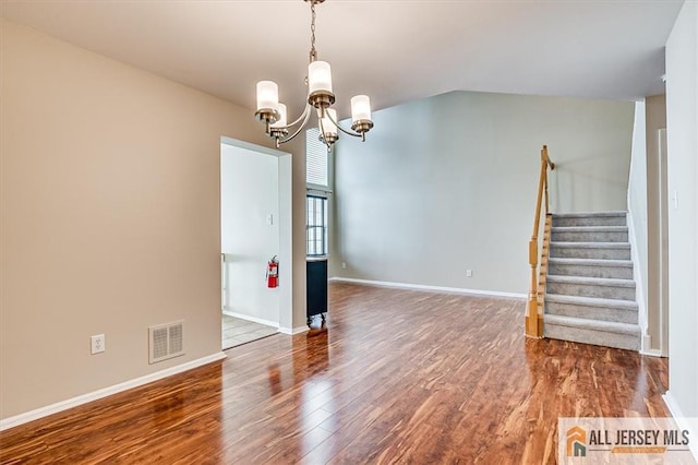 1804 Pheasant Run, South Brunswick, NJ 08852 - spare room with wood finished floors, a chandelier, stairs, and baseboards