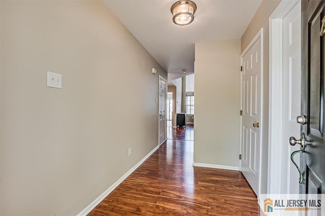 1804 Pheasant Run, South Brunswick, NJ 08852 - hallway featuring dark wood-type flooring and baseboards