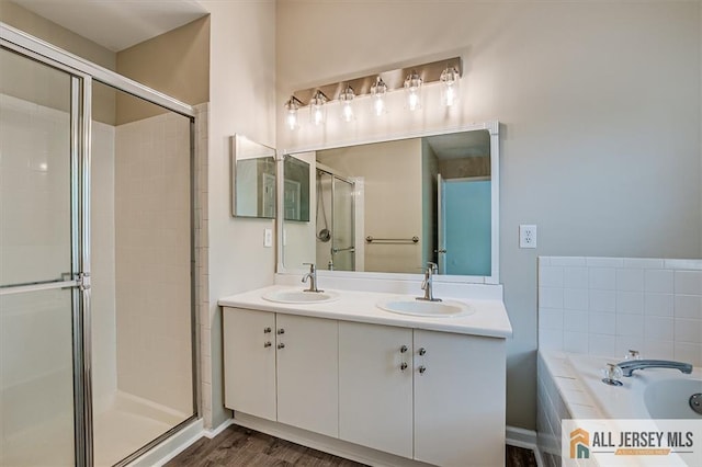 1804 Pheasant Run, South Brunswick, NJ 08852 - bathroom featuring a stall shower, a bath, double vanity, and wood finished floors