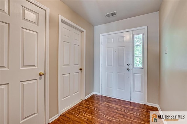1804 Pheasant Run, South Brunswick, NJ 08852 - entrance foyer featuring dark wood-type flooring and baseboards