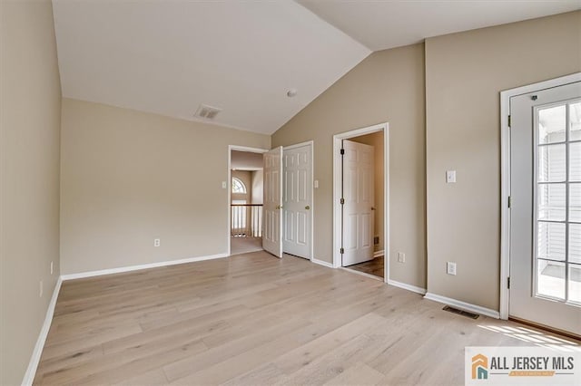 1804 Pheasant Run, South Brunswick, NJ 08852 - unfurnished bedroom with multiple windows, lofted ceiling, light wood finished floors, and baseboards