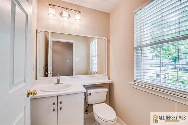 1804 Pheasant Run, South Brunswick, NJ 08852 - half bath featuring healthy amount of natural light, vanity, toilet, and baseboards