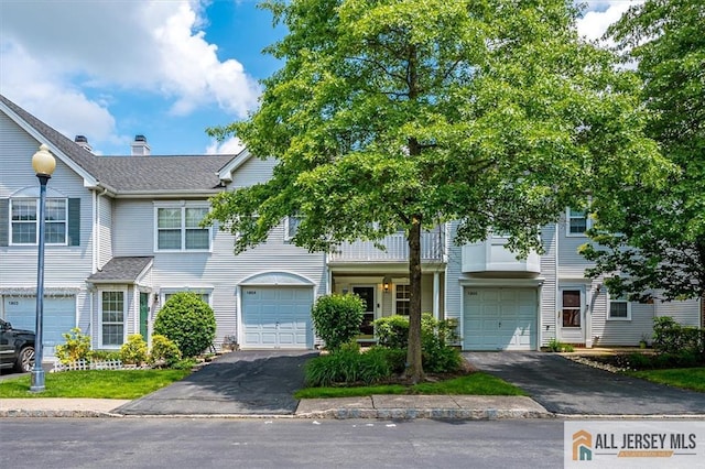 1804 Pheasant Run, South Brunswick, NJ 08852 - view of property with driveway, an attached garage, and a shingled roof