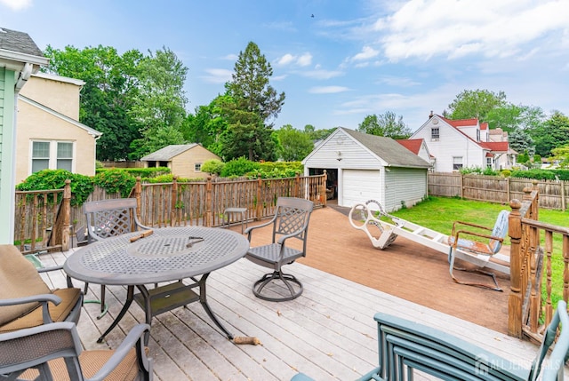 139 Palmer Ave, South Plainfield, NJ 07080 - wooden terrace with a fenced backyard, an outbuilding, and a detached garage