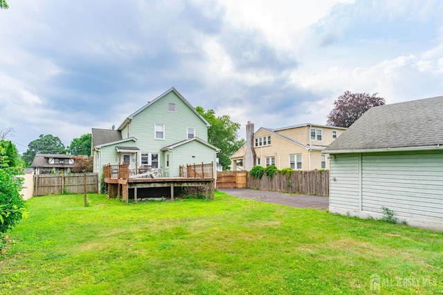 139 Palmer Ave, South Plainfield, NJ 07080 - rear view of property with a fenced backyard and a deck
