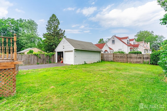 139 Palmer Ave, South Plainfield, NJ 07080 - view of yard with an outdoor structure, a garage, and driveway