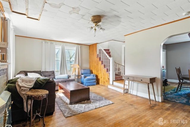 139 Palmer Ave, South Plainfield, NJ 07080 - living room featuring arched walkways, ceiling fan, crown molding, stairway, and wood-type flooring