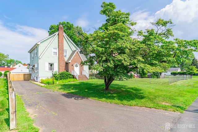 139 Palmer Ave, South Plainfield, NJ 07080 - view of front of home with a chimney and driveway