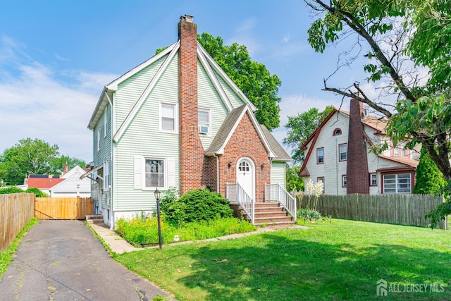 139 Palmer Ave, South Plainfield, NJ 07080 - view of front of house featuring a chimney and brick siding