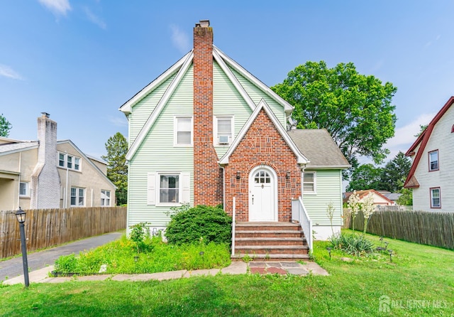 139 Palmer Ave, South Plainfield, NJ 07080 - view of front of house with a chimney and brick siding