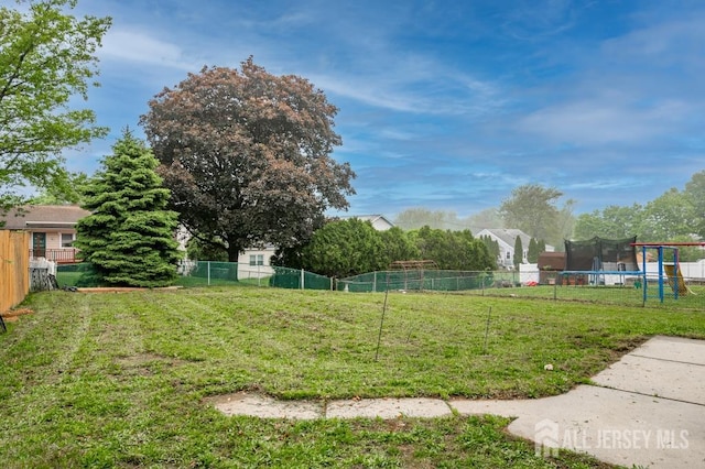view of yard featuring a trampoline