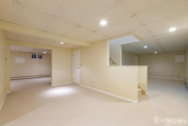 6 Persimmon Ct, East Brunswick, NJ 08816 - finished basement featuring a baseboard radiator, light carpet, stairs, recessed lighting, and a paneled ceiling