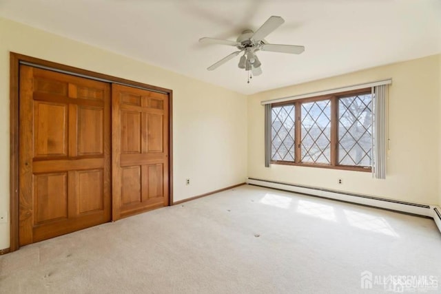 6 Persimmon Ct, East Brunswick, NJ 08816 - unfurnished bedroom featuring baseboard heating, light carpet, a closet, and a ceiling fan
