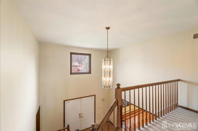 6 Persimmon Ct, East Brunswick, NJ 08816 - staircase featuring a chandelier
