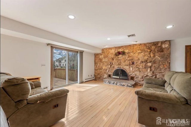 6 Persimmon Ct, East Brunswick, NJ 08816 - living area featuring baseboard heating, light wood-style flooring, a fireplace, and recessed lighting