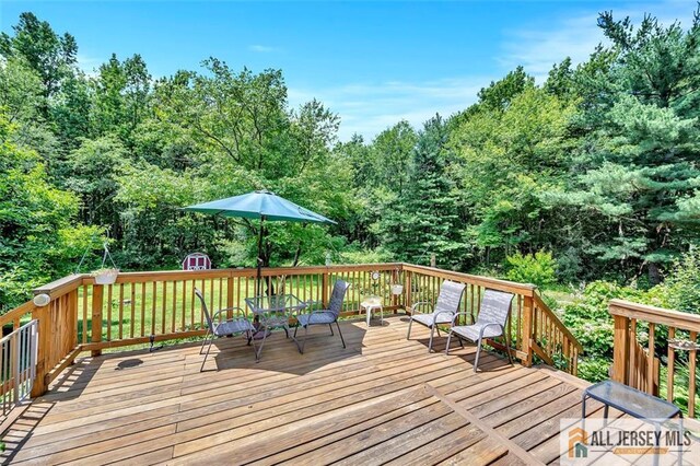 deck featuring a storage shed